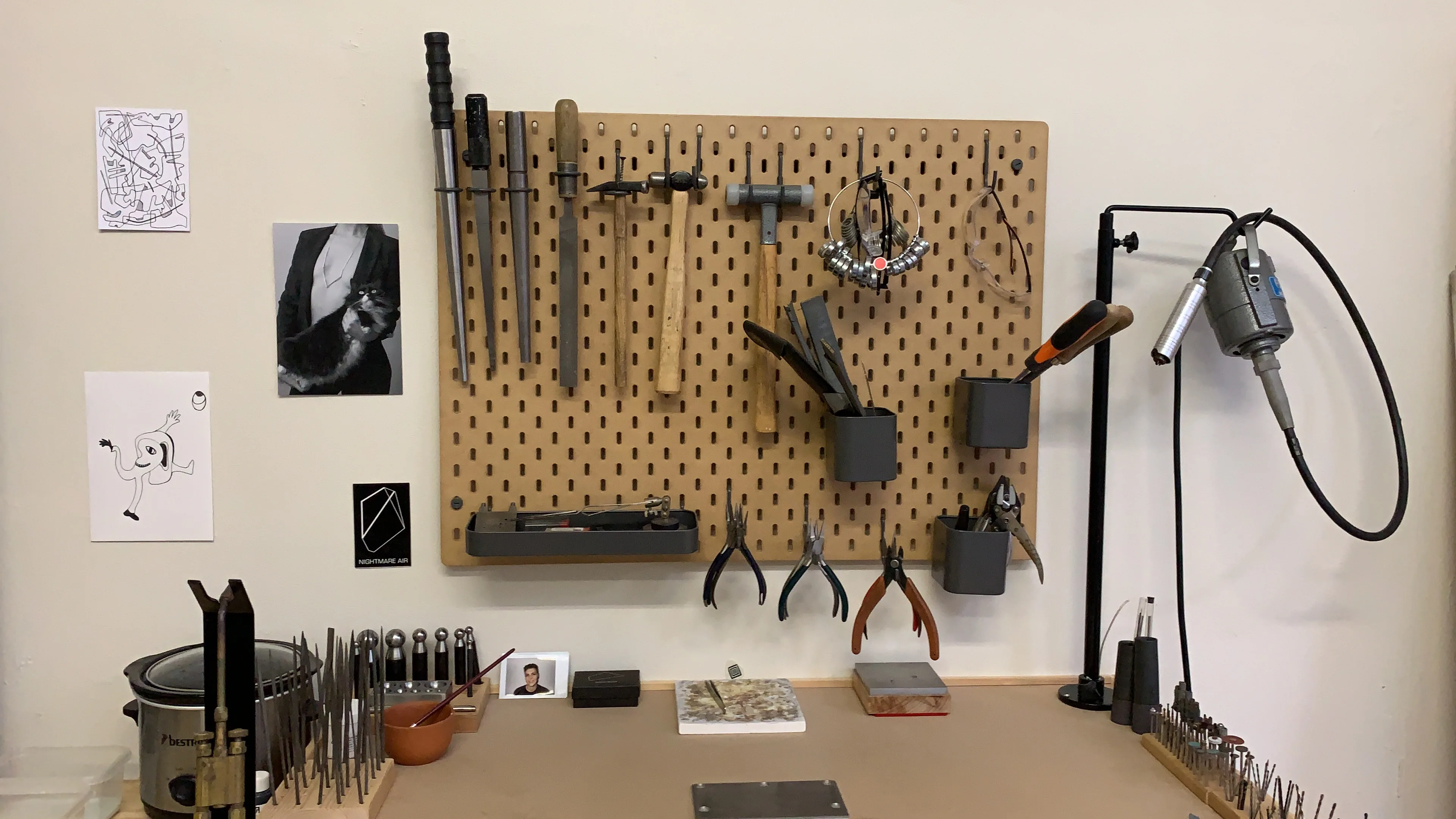 Studio workshop interior with tools and equipment hanging on the wall