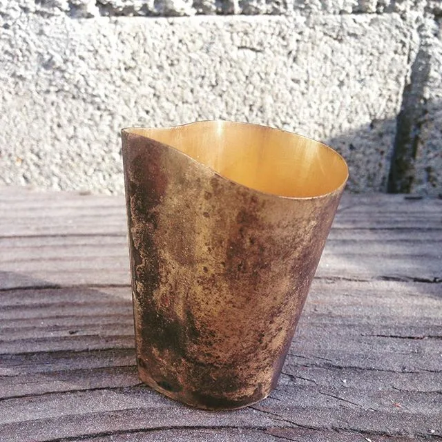 Brass vessel with a polished interior and patinated exterior