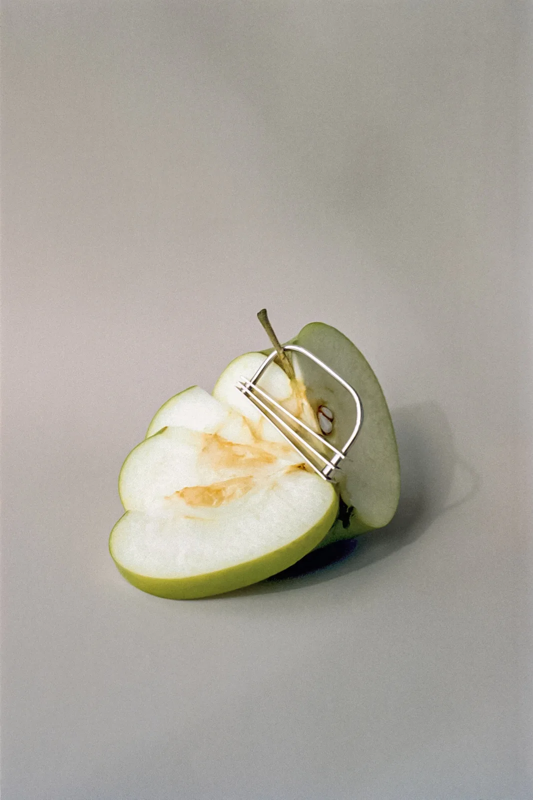 Small sculptural ring on a sliced apple